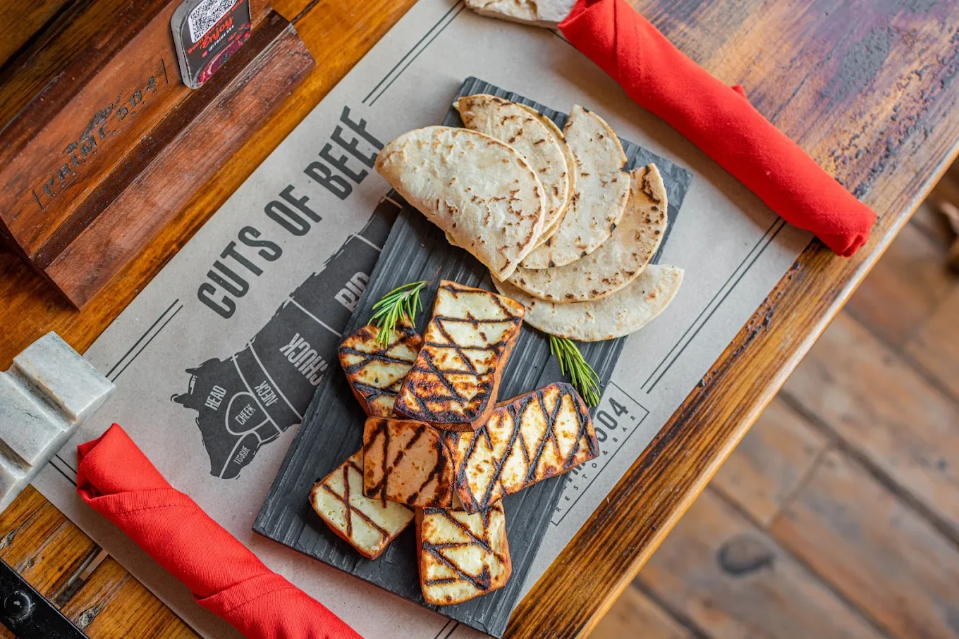 Grilled cheese with warm tortillas on a slate board