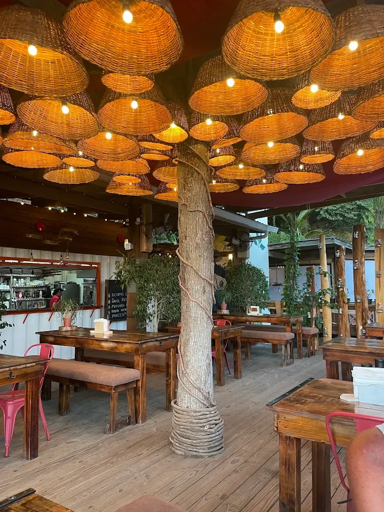 The terrace at Prime 504 under woven basket lamps